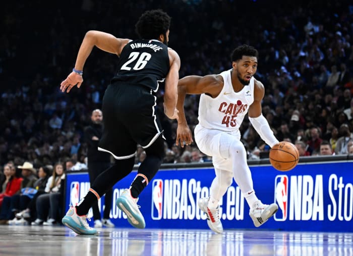 Jan 11, 2024; Paris, FRANCE; Cleveland Cavaliers guard Donovan Mitchell (45) drives to the basket against Brooklyn Nets guard Spencer Dinwiddie (26) in the NBA Paris Game at AccorHotels Arena. Mandatory Credit: Alexis Reau/Presse Sports via USA TODAY Sports